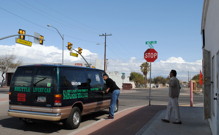 A traveler enters the Nogales Shuttle Service to go from South Tucson to Phoenix on March, 8, 2013. South Tucson features several different shuttle services that take riders to several cities in Arizona (Photo by Kyle Johnson).